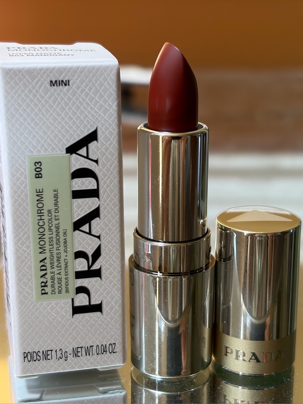 Prada Monochrome Hyper Matte lipstick in B03 Mahogany. MINI size. 0.04oz